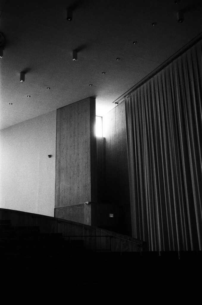 Light coming through a distant window in a concert hall