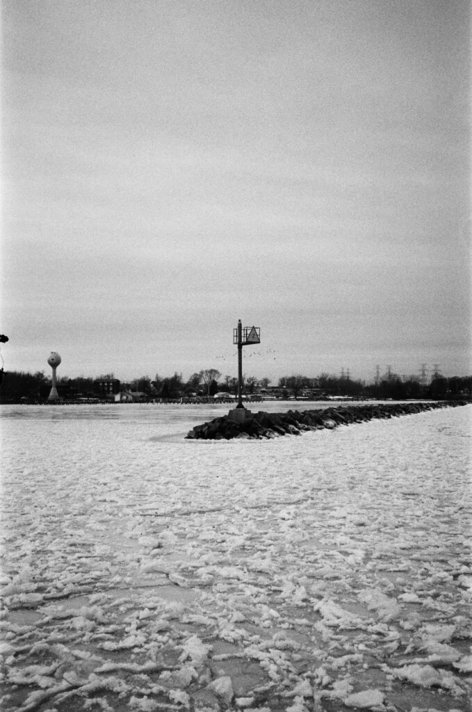 A jetty leading out into a frozen lake