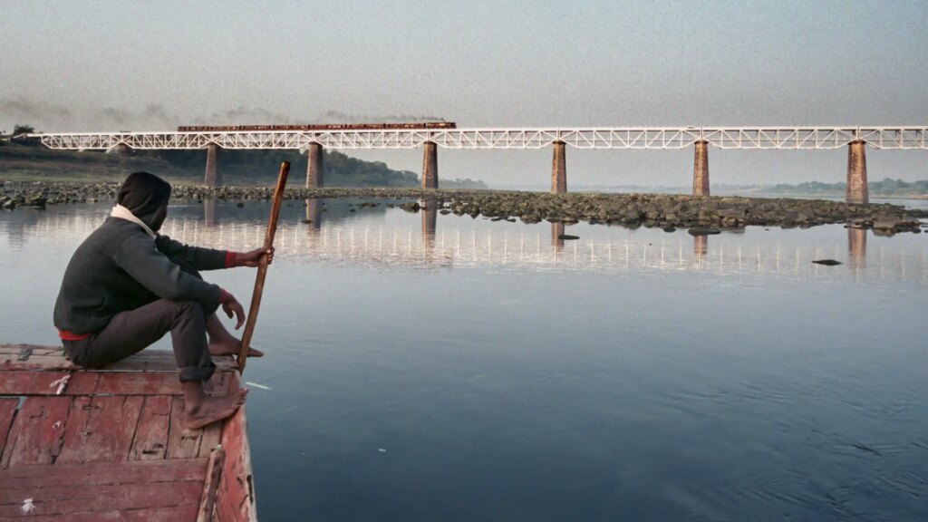 The train passes the bridge over the river Narmada