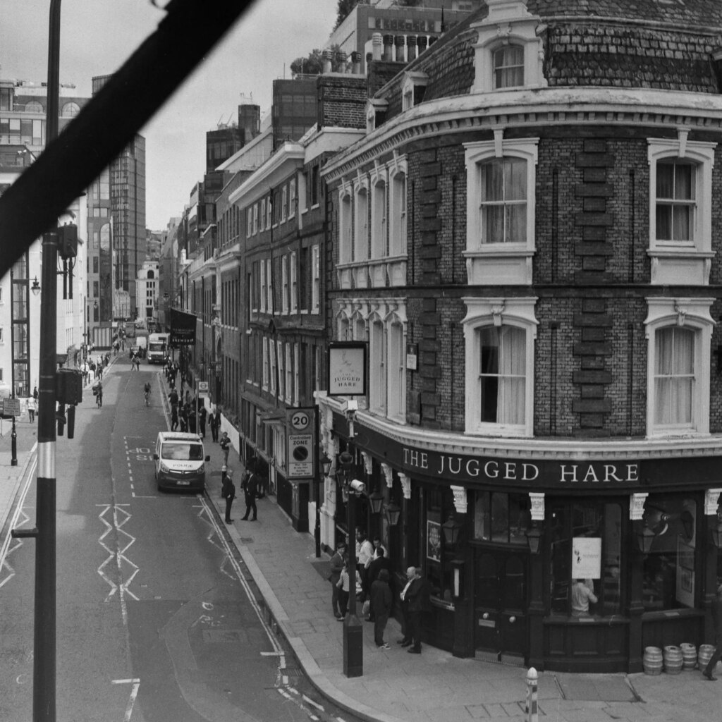 Black and white photo of pub, with black strip from defective camera light seal 