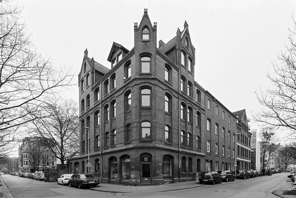Black-and-white photograph of a Gründerzeit house located in Linden quarter of Hannover, Germany.