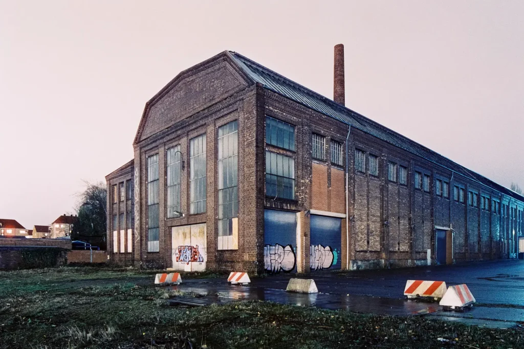 Abandoned ironworks building shot at night on CineStill film