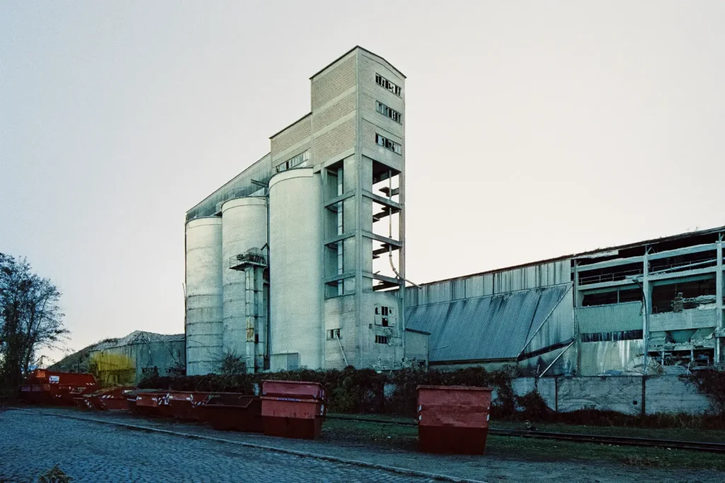 abandoned cement works building shot at night on CineStill film