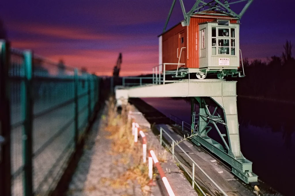 old loading crane shot at night on CineStill film