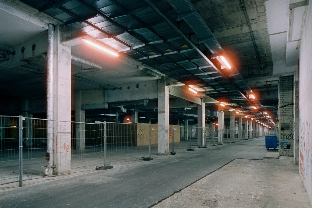 long corridor inside "Ihme-Zentrum" housing complex in Hanover, shot at night on CineStill film