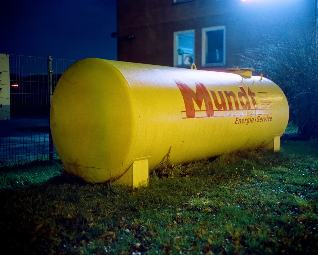 yellow fuel tank shot at night on CineStill film