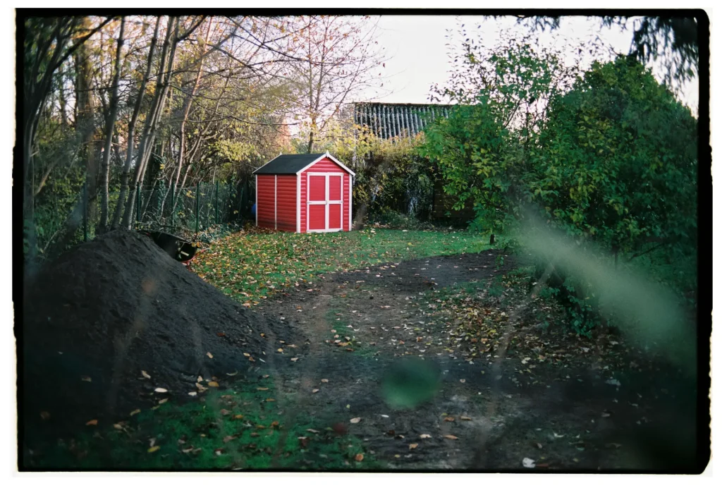 a bright red garden shed shot on Fuji Superia 400 film