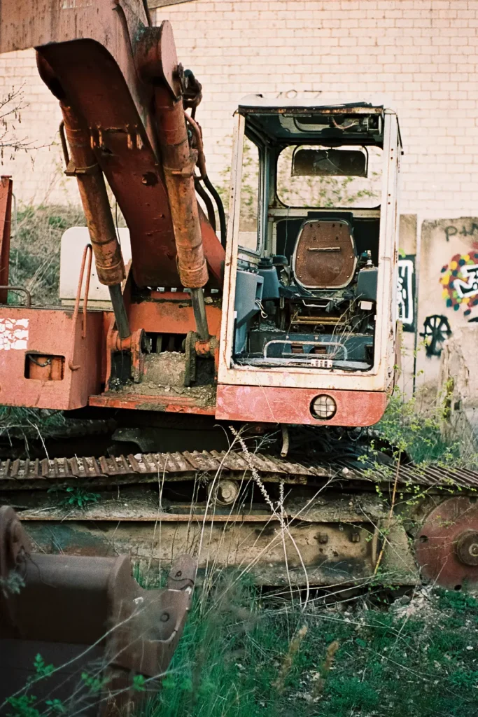 Abandoned and heavily damaged excavator.