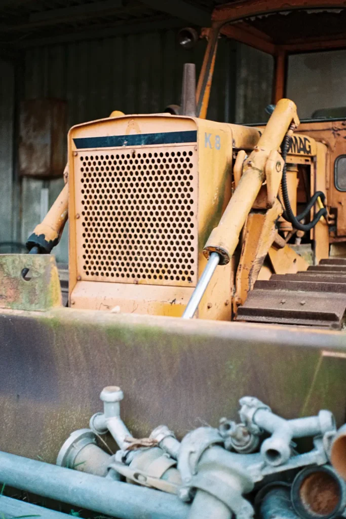 Detail of an orange bulldozer found at the machine boneyard.
