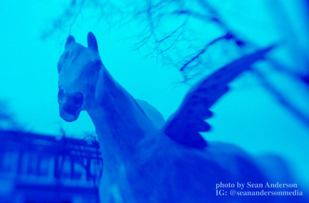 photograph of horse sculpture with strong blue tint