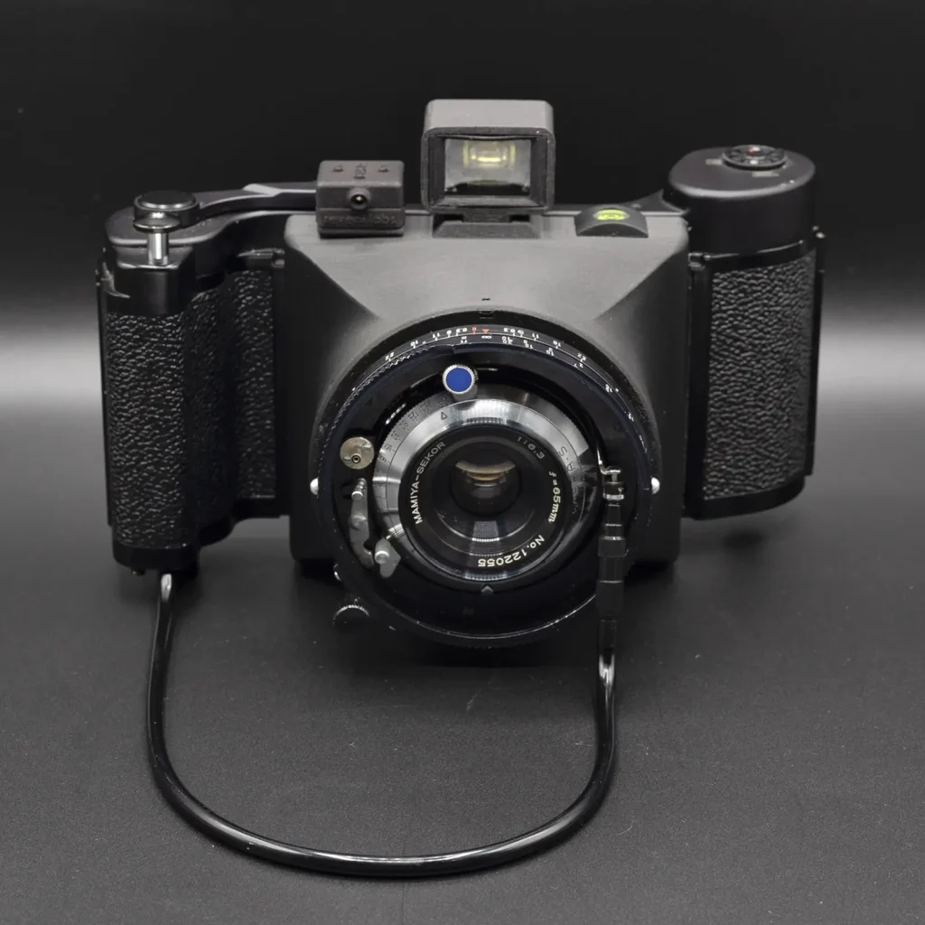 Ligero69, shown with Mamiya Sekor 65mm f/6.3, Mamiya roll film 6x9 Model 3 back, Reveni light meter, custom viewfinder, bubble level.