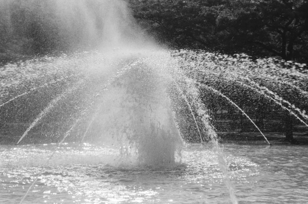 Close view of a fountain with water drops in the air