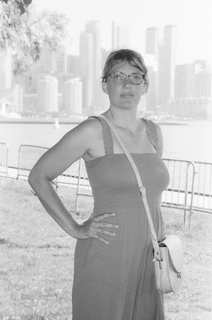 Portrait of a woman with a city skyline in the background