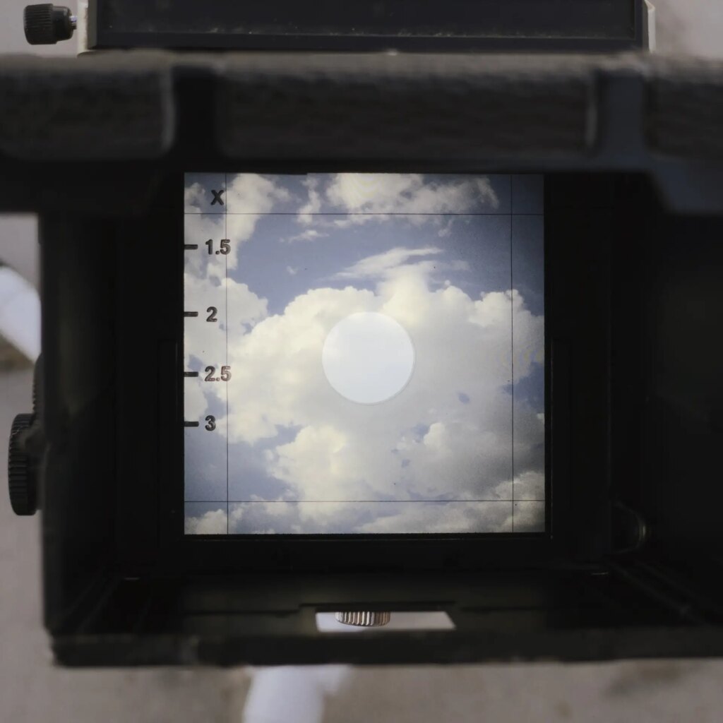 Clouds in the waist level finder of the camera