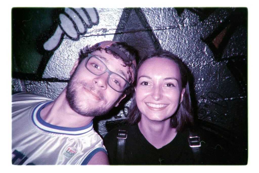 couple taking a selfie on lomochrome purple