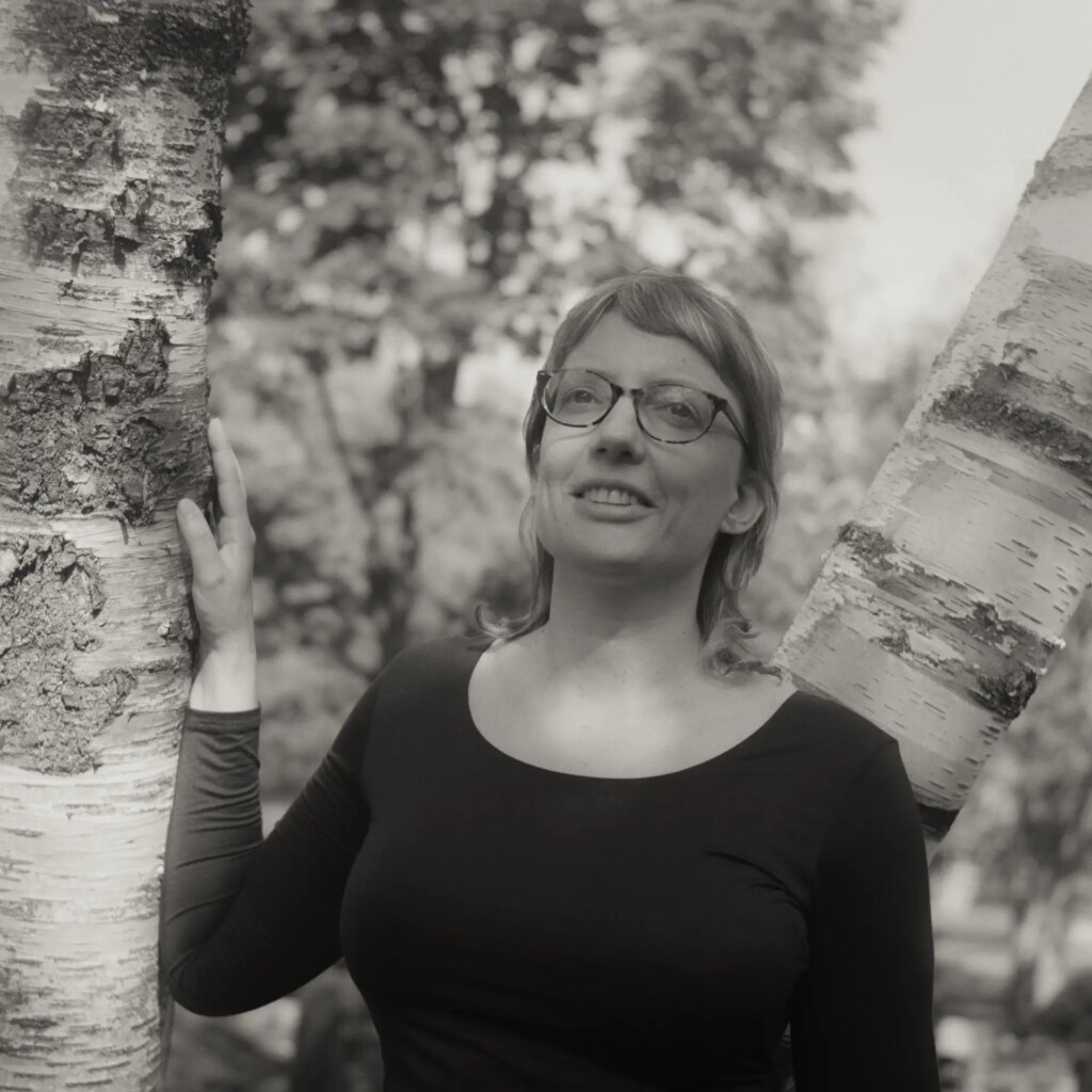 Portrait of a woman near birch trees