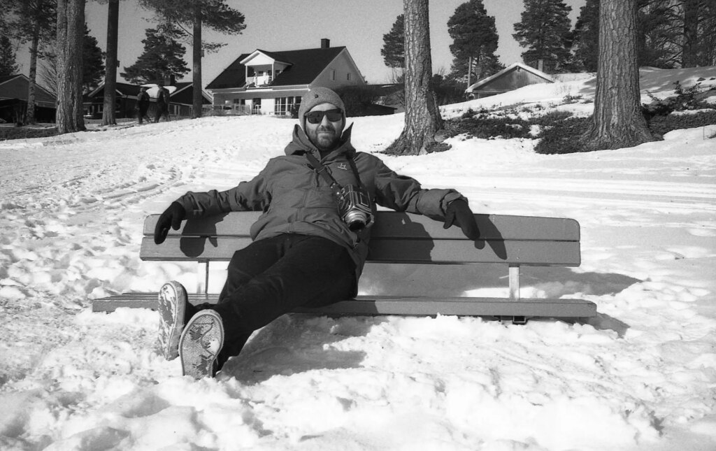 Man on bench in snow 