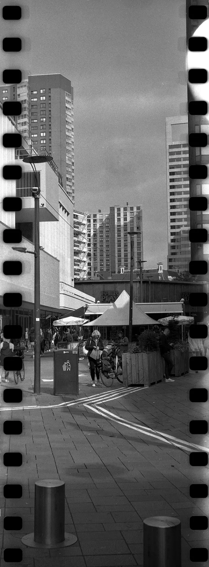 Vertical panorama of a street scene in a city center