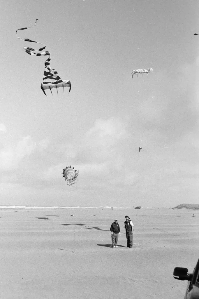 men flying kites