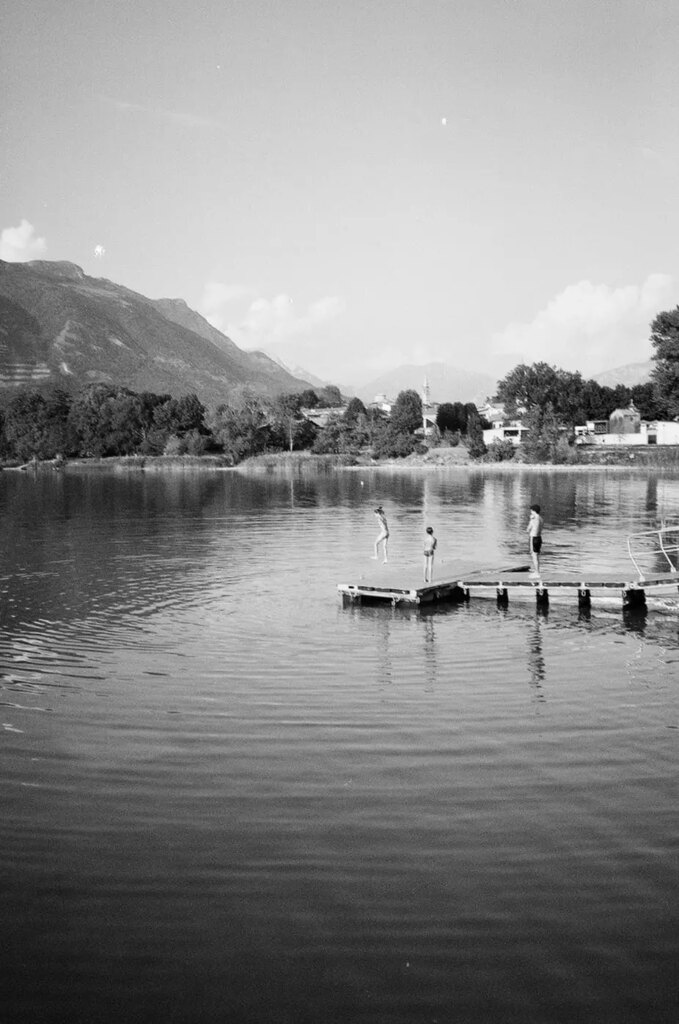 children jumping in the water 