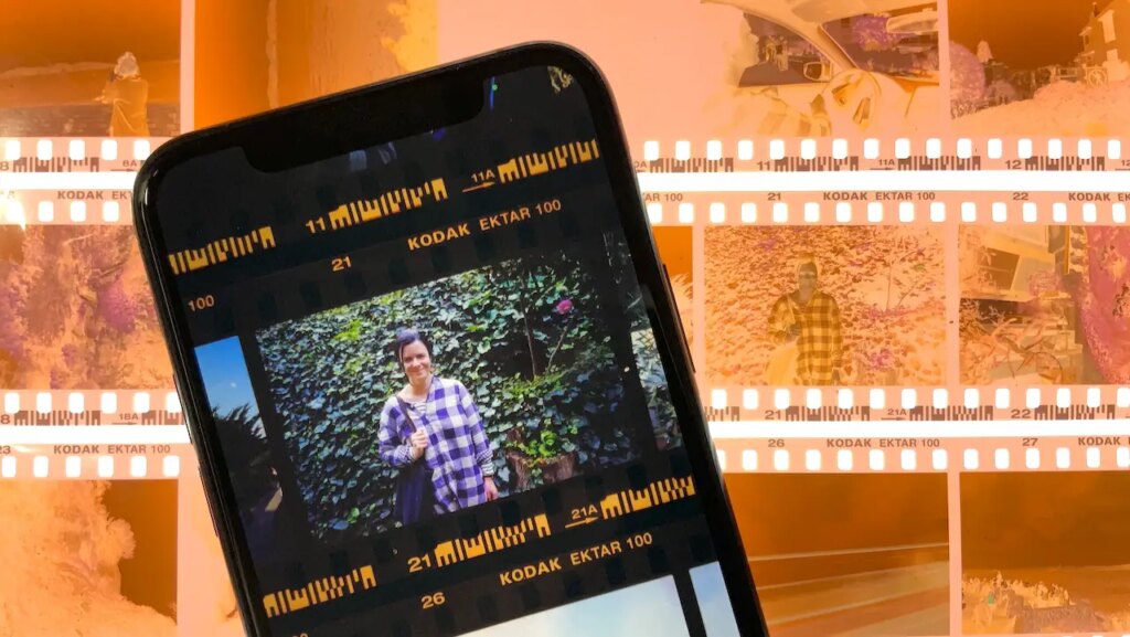 filmlab mobile app on phone with negatives in the background on a light table