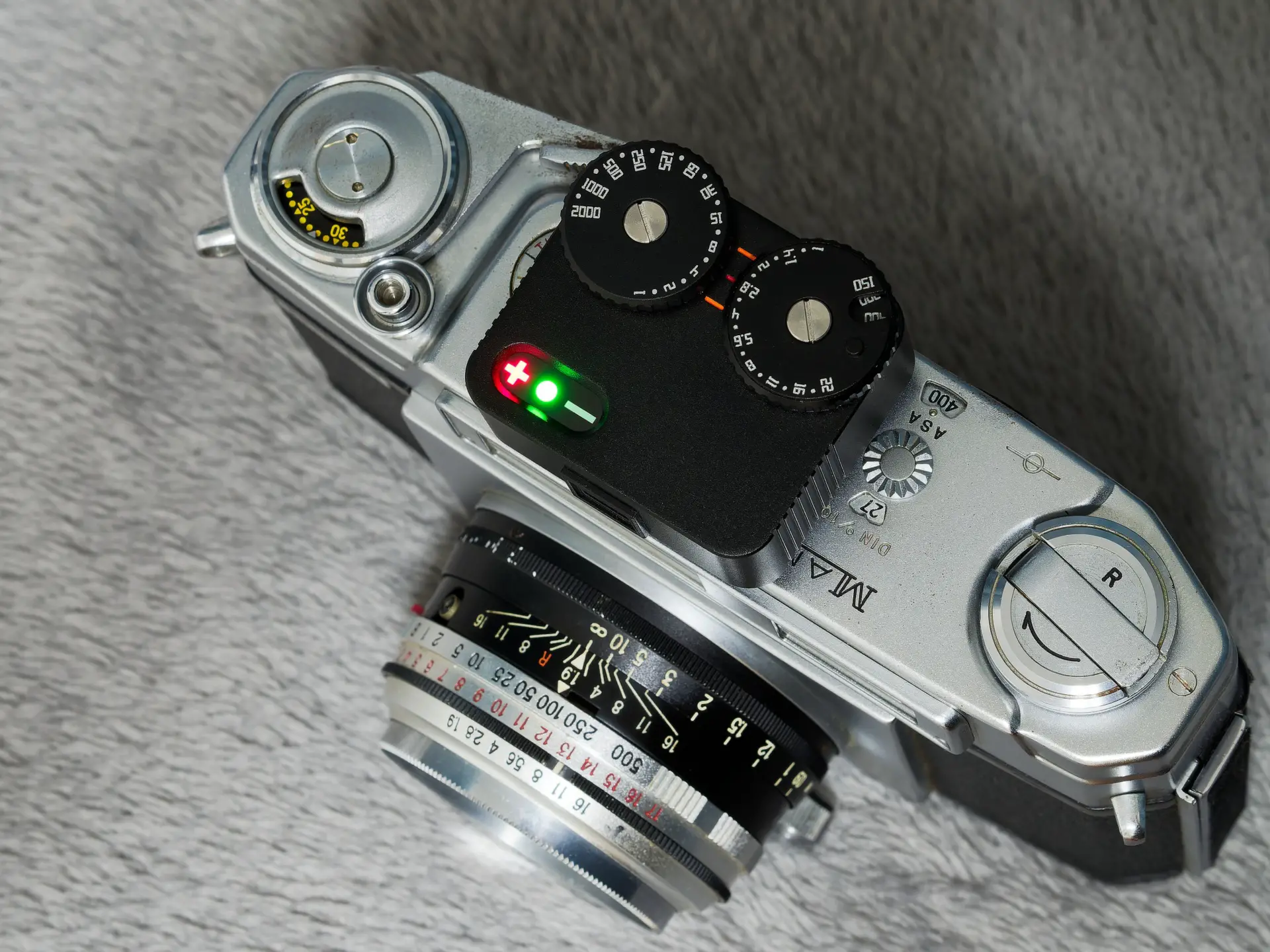 TTArtisan Lightmeter II on top of rangefinder camera