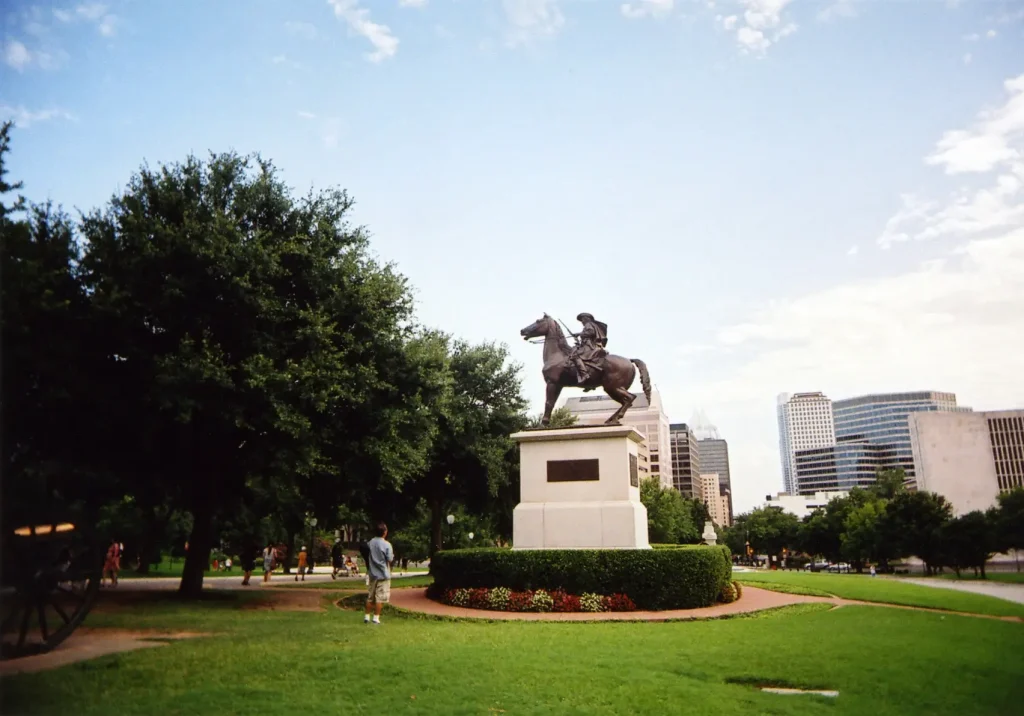 man looking at statue taken with a White Slim Angel ultra wide 35mm point and shoot film camera