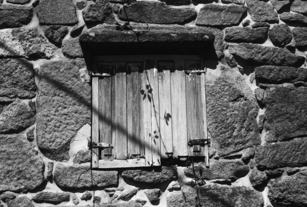 wooden window in stone building
