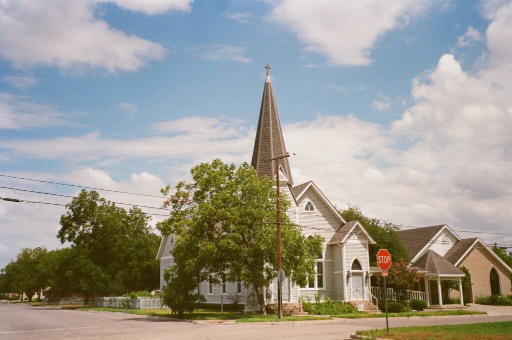 Church on street corner by stop sign