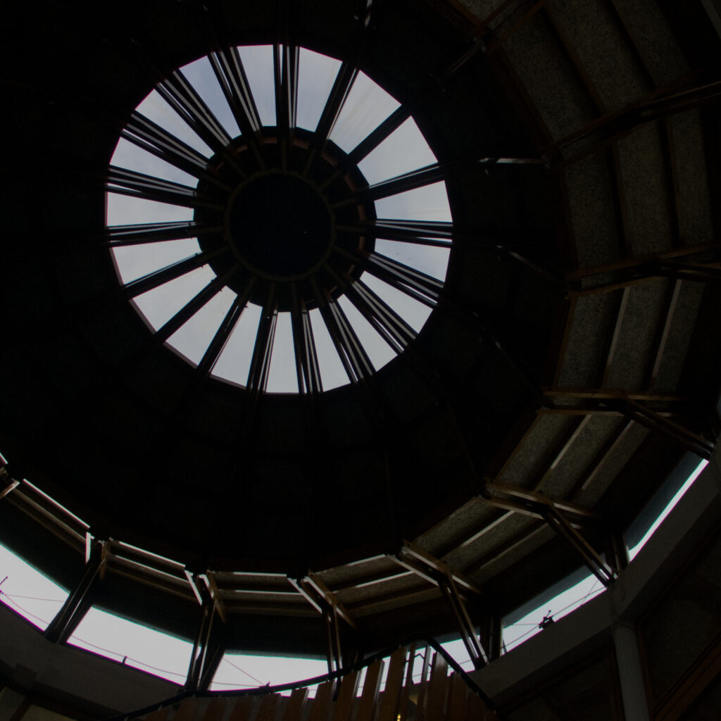 Picture of the inside of a building showing a spiral staircase 