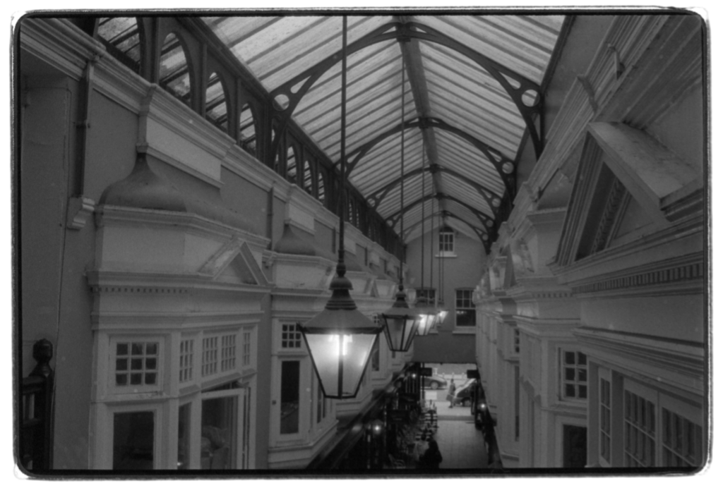 Lights hanging down from the roof of an arcade.