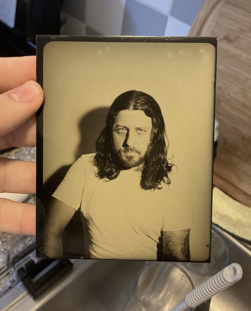 Tintype plate freshly pulled from water rinse after fixing