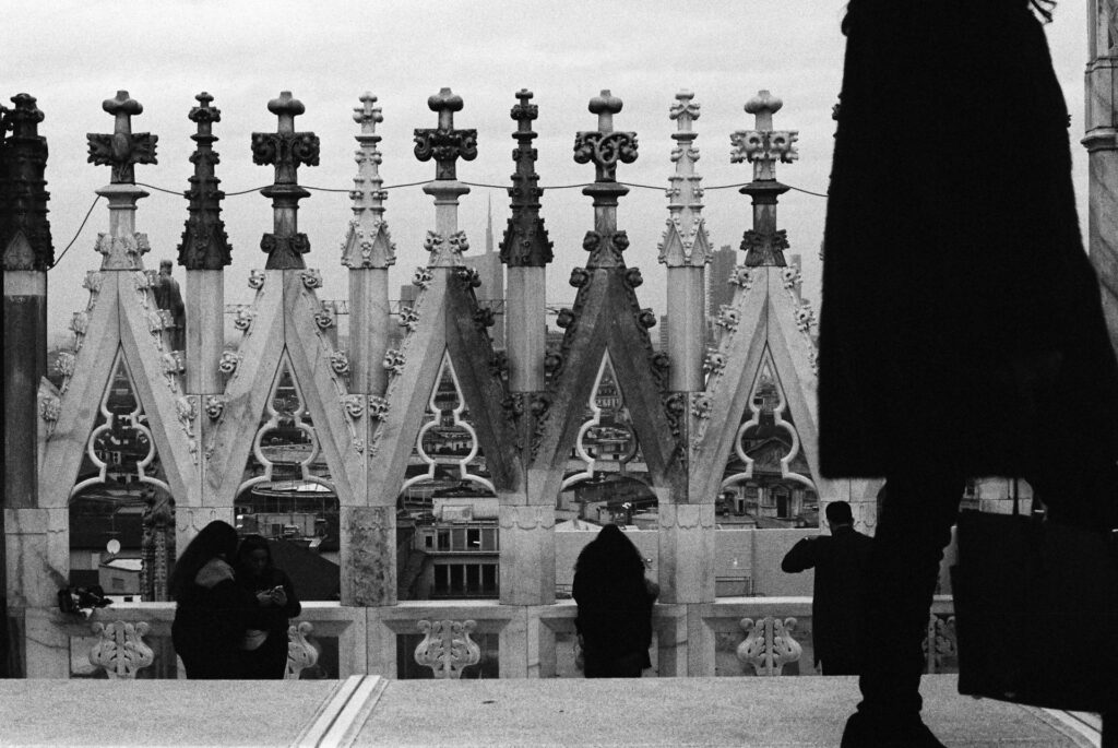 Tourists looking out from the Duomo's rooftop