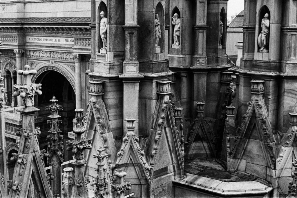 Detail of the Duomo's towers with the Galleria Vittorio Emmanuele in the background