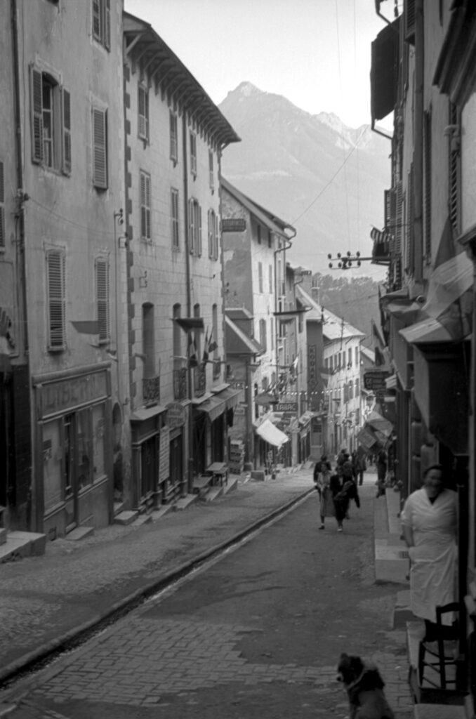 Black and white image of a street in Briançon, France.