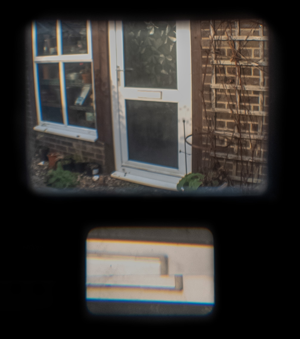 Through the viewfinder. Composing frame above, and magnified split-image focusing patch below.