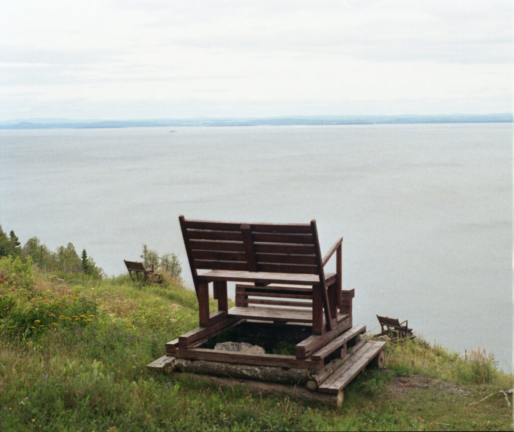 wooden chair overlooking river 