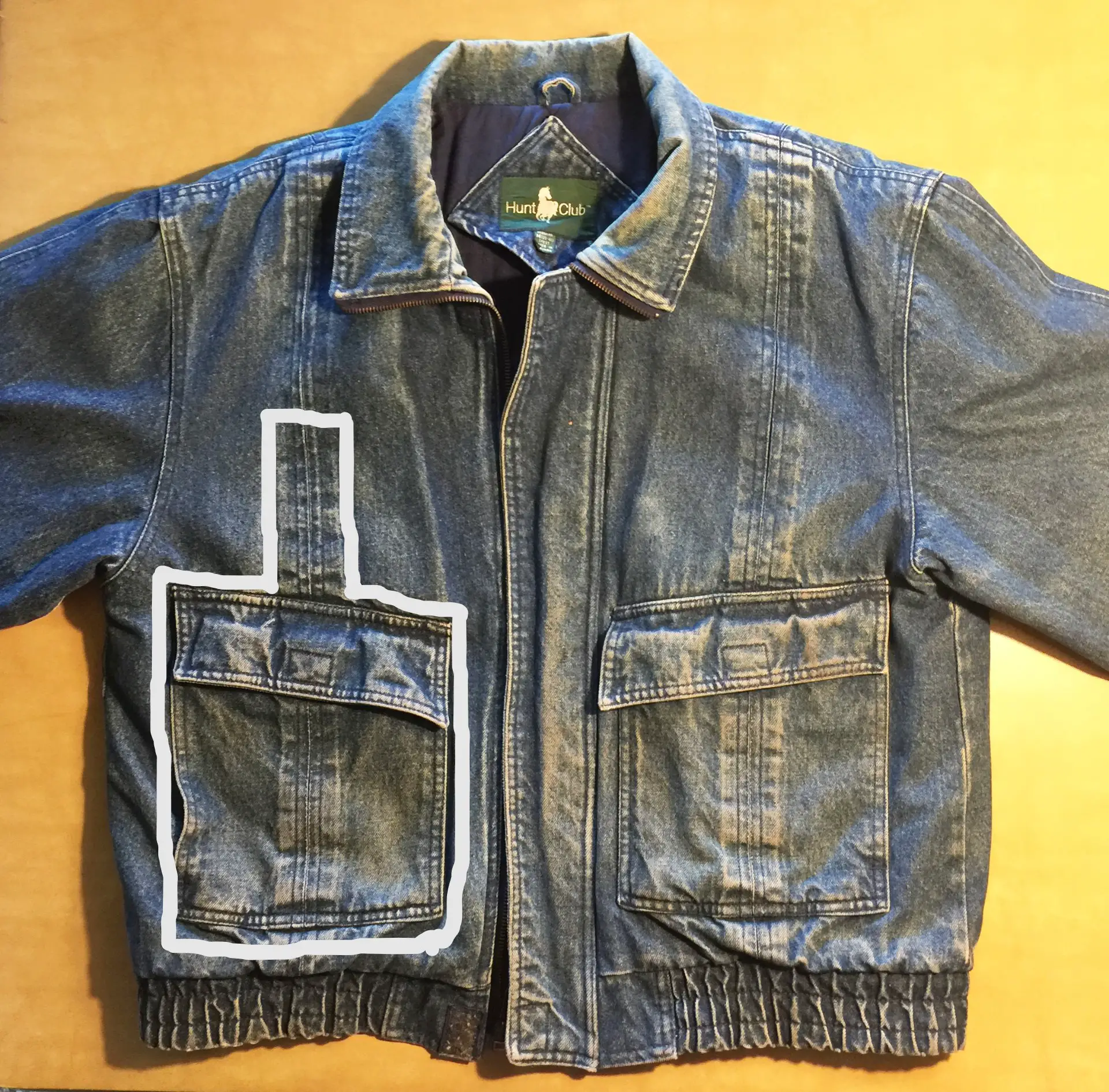 Denim jacket with pocket cut line shown in white