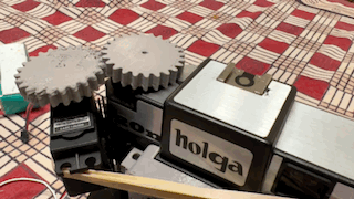 an animated gif showing the servo driving the gears to turn the film advance. 