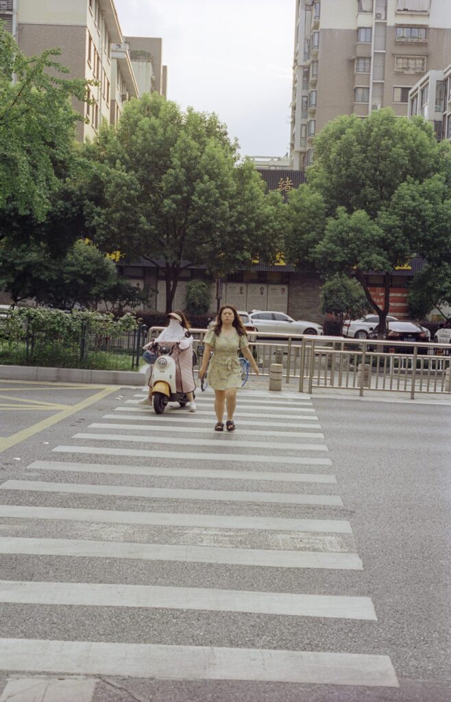 Crossing the street in China can be a daunting affair, but locals handle it with reckless abandon.