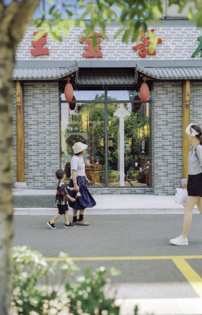 A mom and son looking for a place to eat in the ridiculous Summer heat in Hangzhou, China