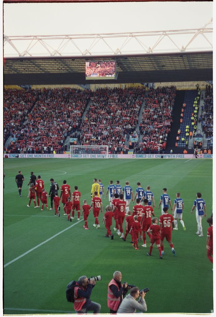 Liverpool and Darmstadt 98 walk out at Deepdale.