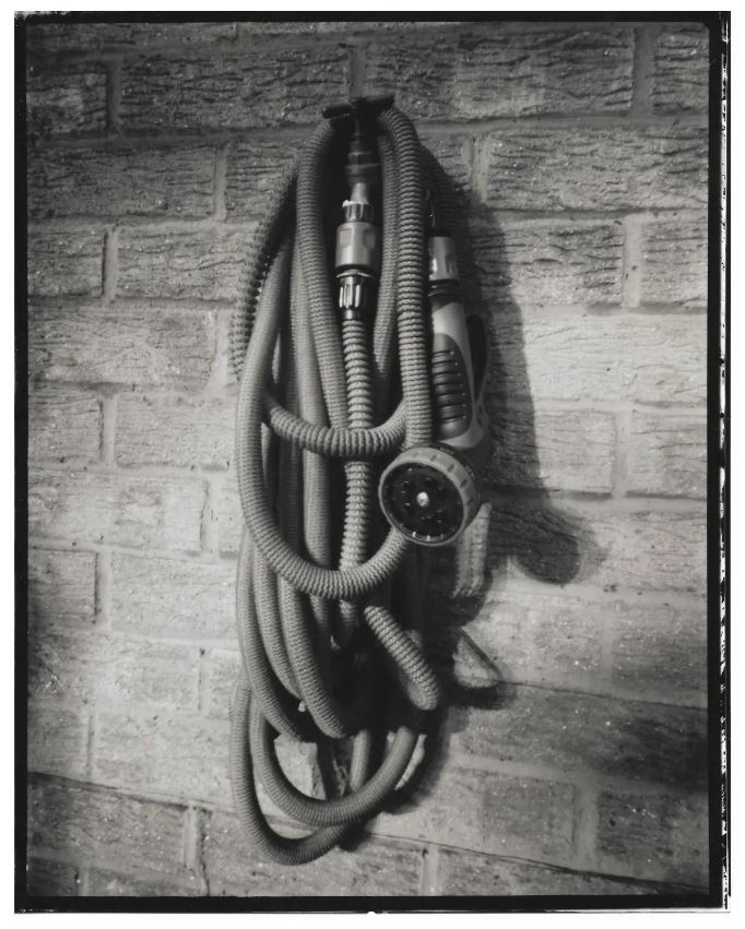 BW reversal photo of a garden hose