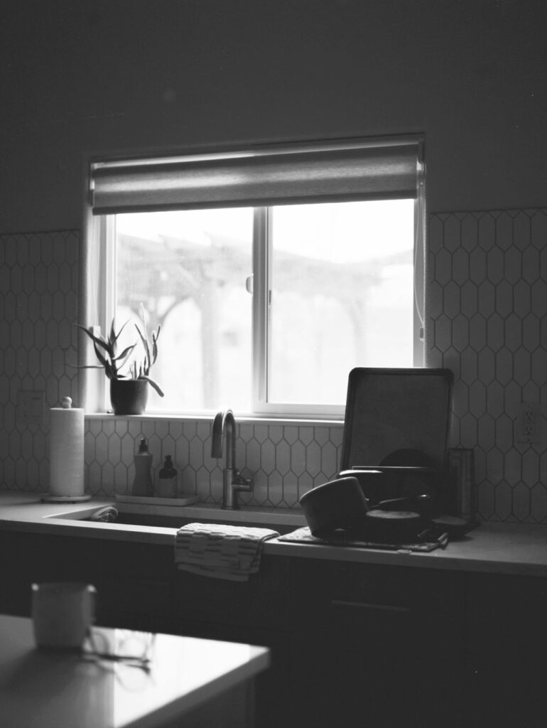 Kitchen window with the sun coming through. 