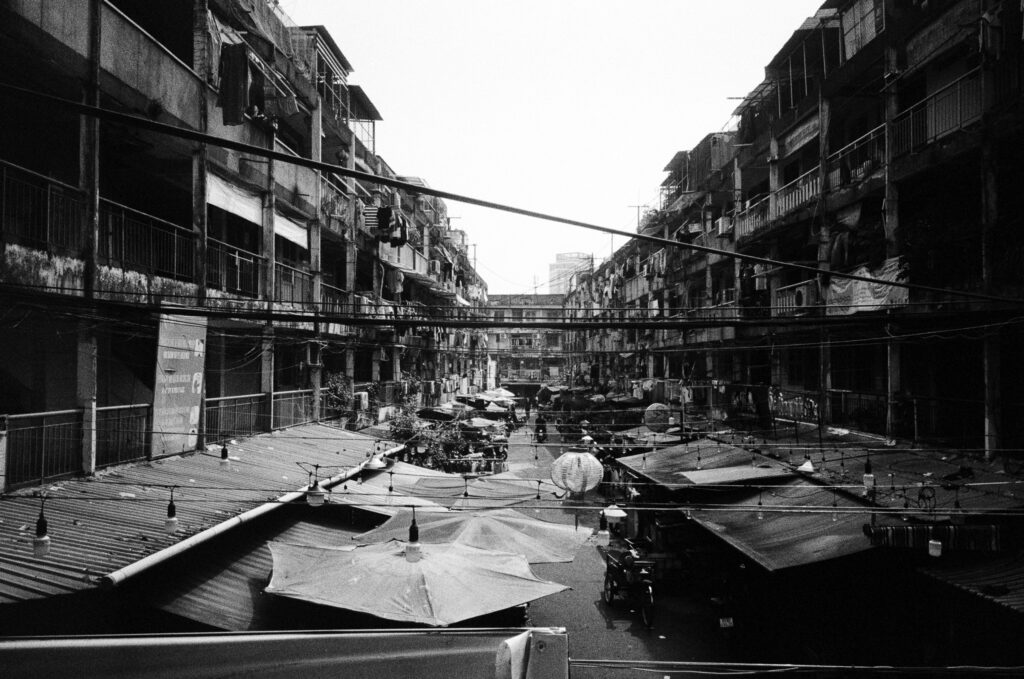 View from the apartment building balcony overlooking Saigon's oldest apartment block, in Nguyen Thien Thuat, built in 1968.