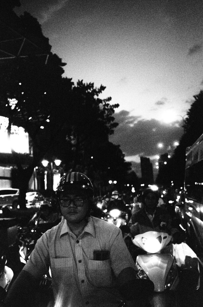 Motorcycle on Saigon freeway at dusk.