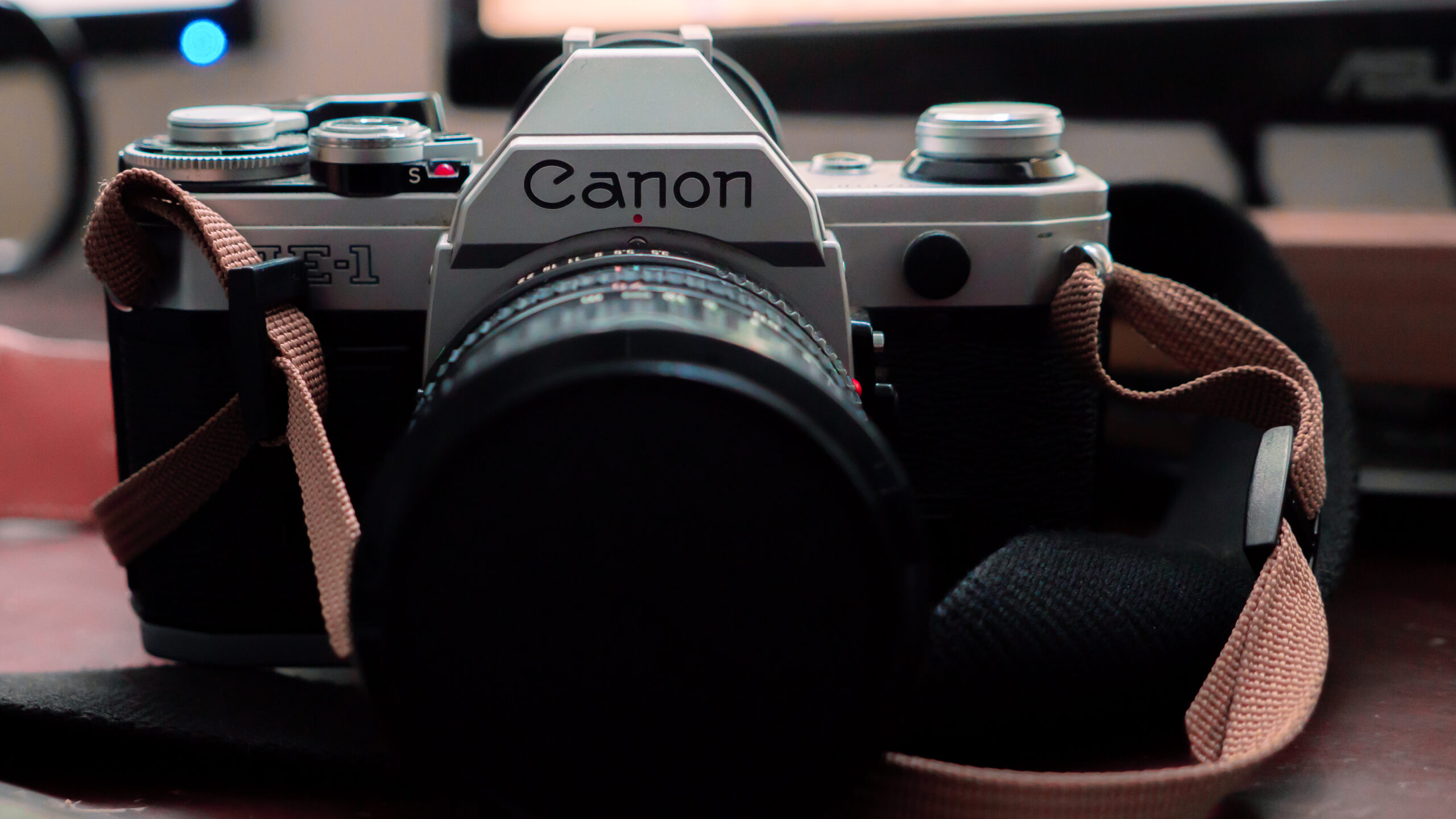Close up of Canon AE-1 35mm camera on desk