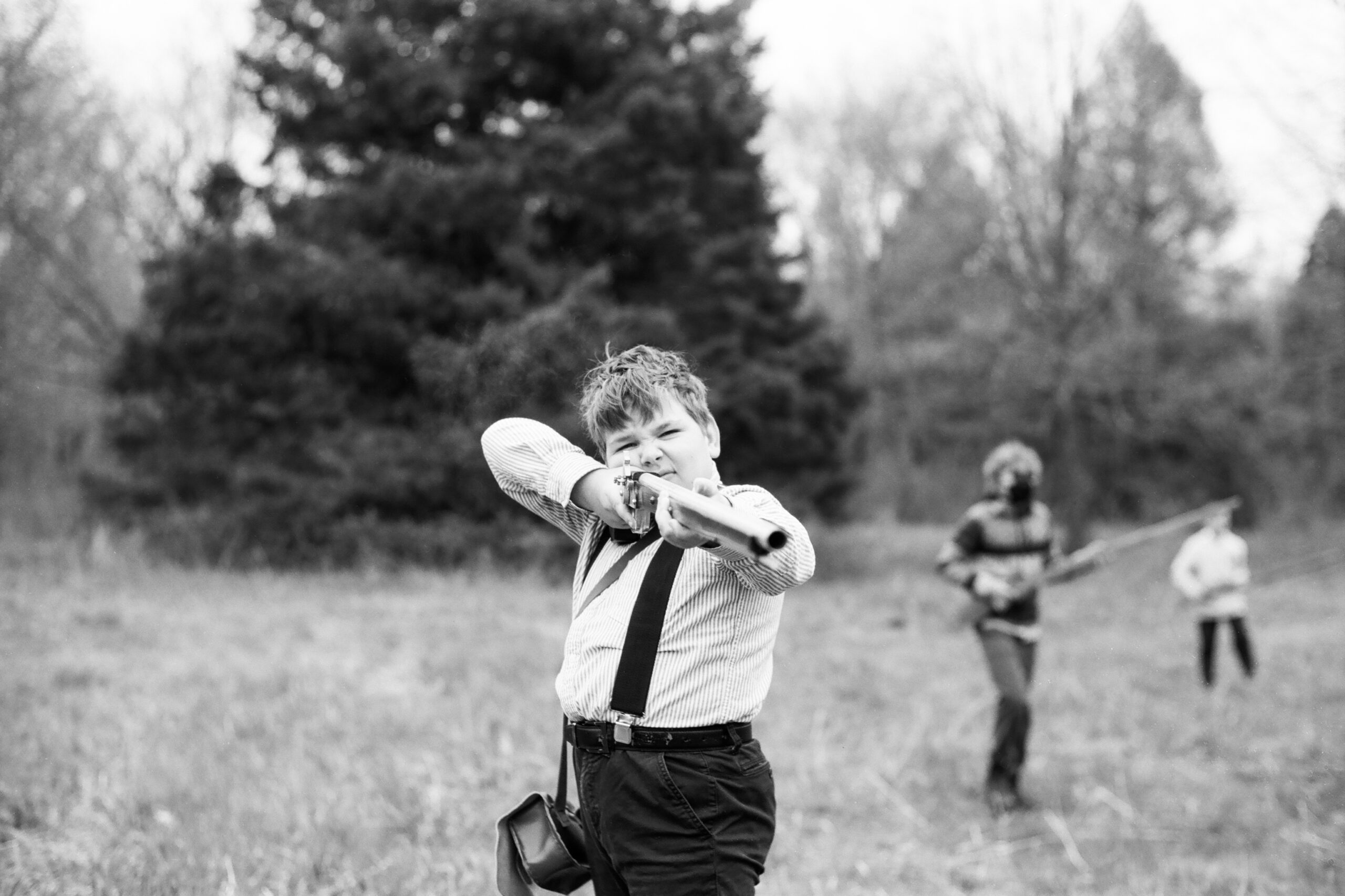 Boy holding musket