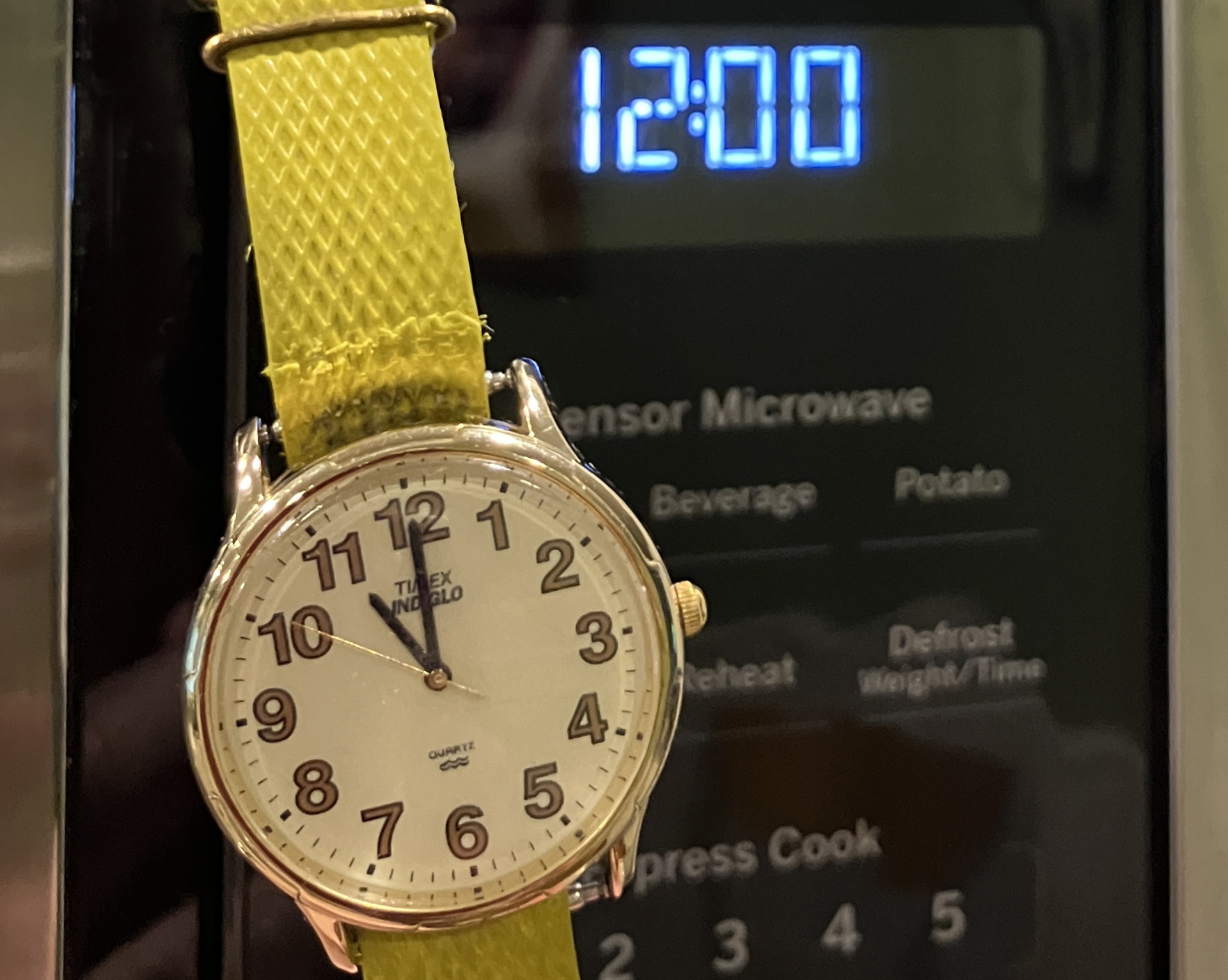 A watch and digital clock... one hour apart