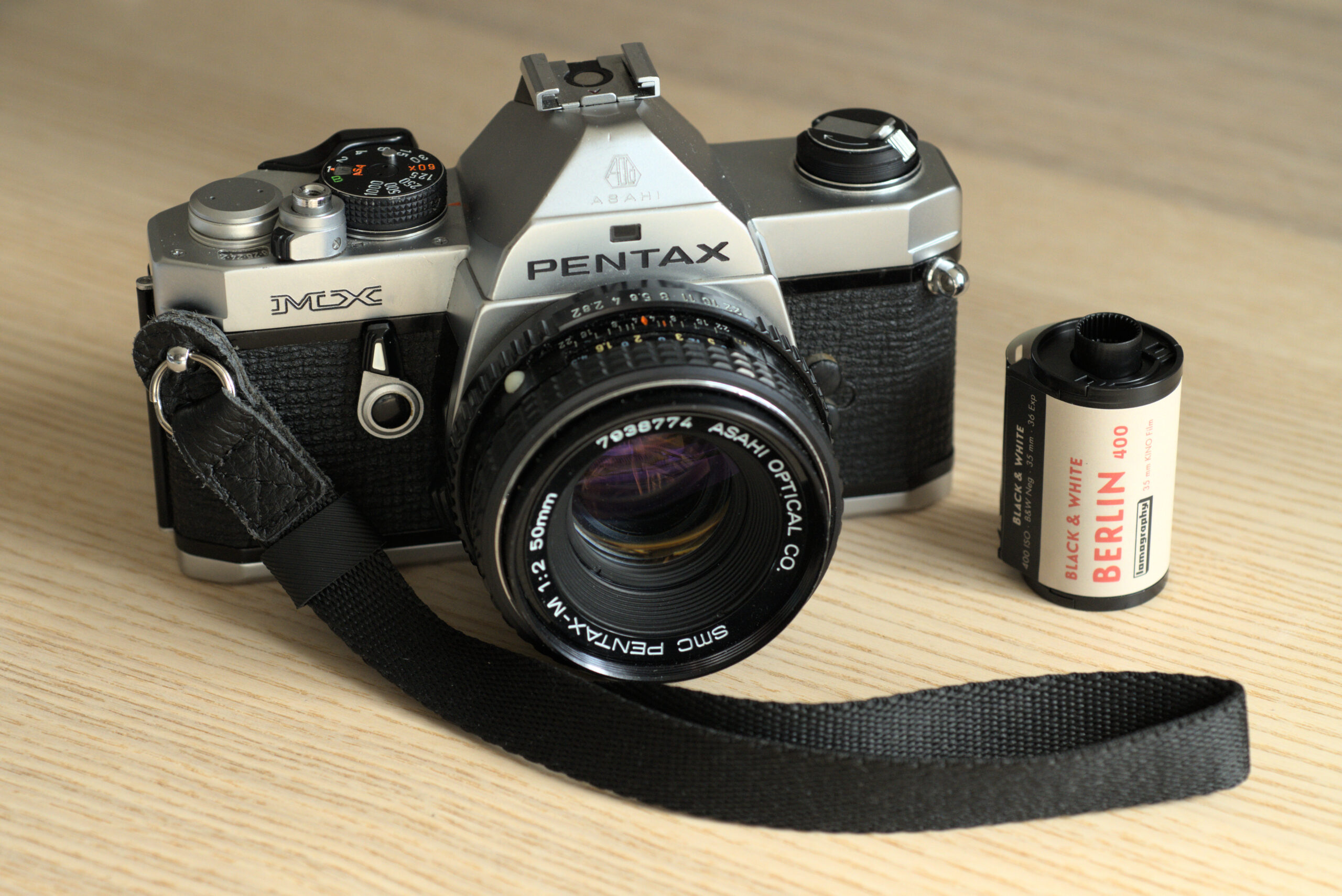 Pentax MX camera with a roll of Lomography Berlin 400 film
